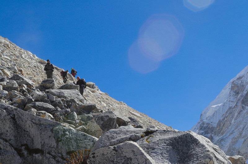 Trekkers descending from Larkya La Pass
